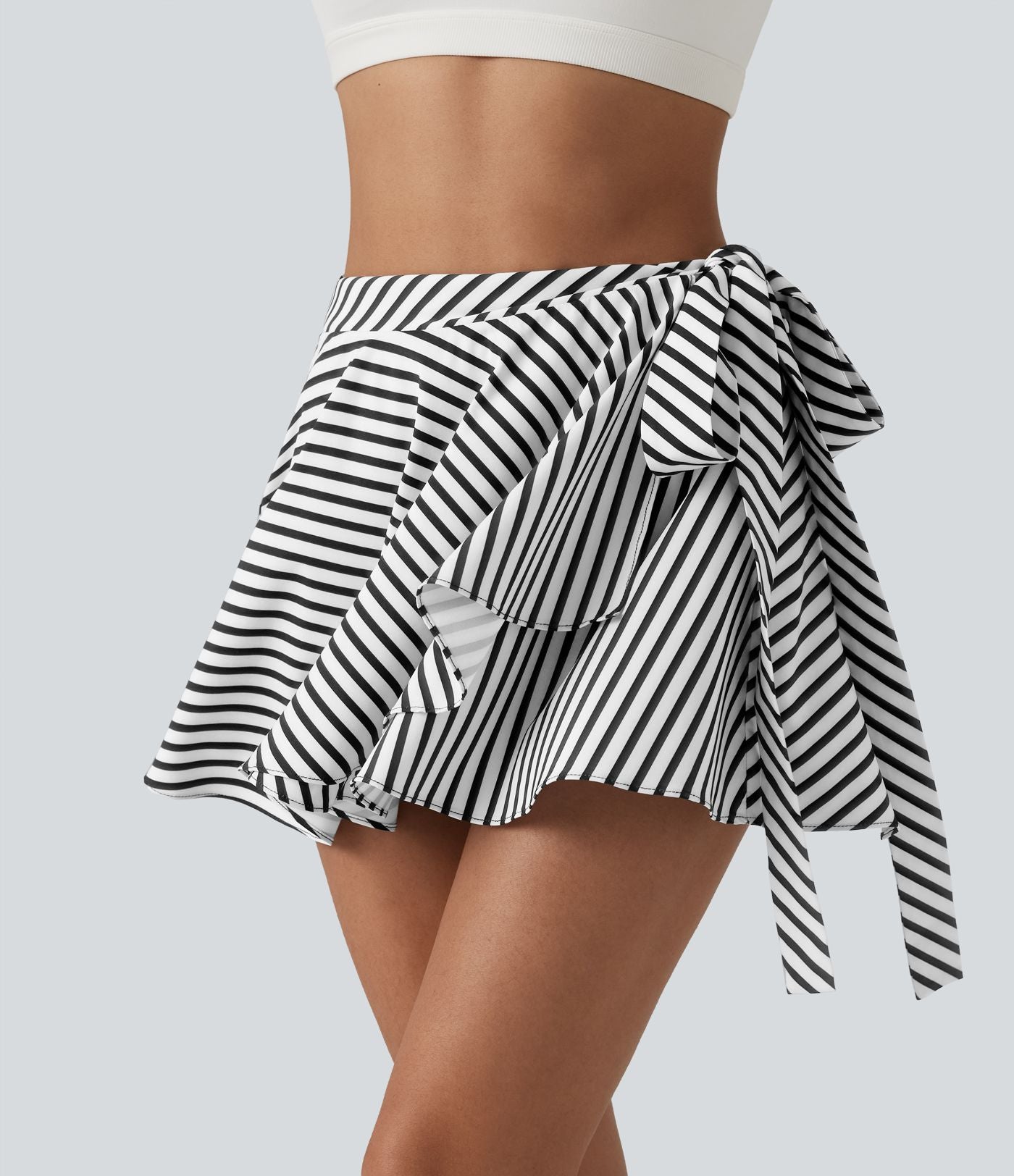 Jupe tennis mini fluide 2-en-1 taille haute imprimé léopard avec liens latéraux et poche
