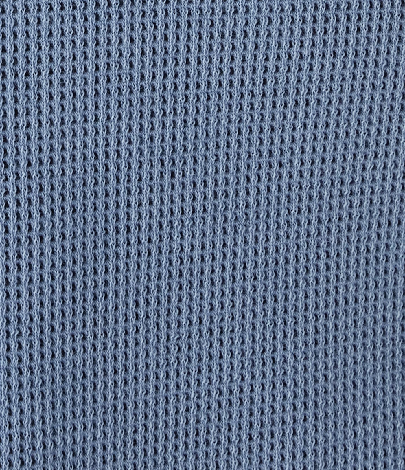 Jean décontracté taille basse en maille gaufrée extensible, jambe large avec poches multiples et fermeture zippée