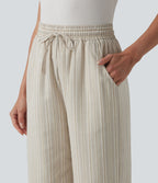 Pantalon tailleur large en lin rayé taille haute avec cordon de serrage et poches