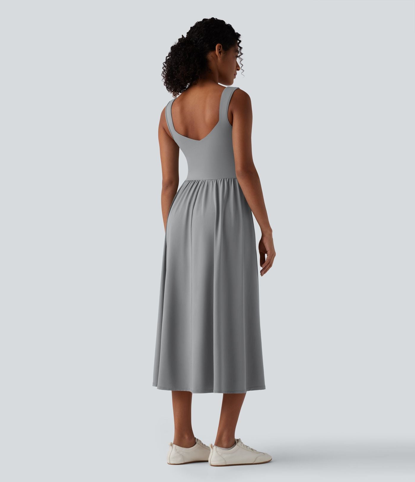 Robe midi fluide sans manches dos croisé ouvert avec poches
