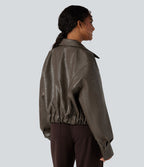 Veste décontractée en tissu enduit à fermeture éclair et manches longues avec poches