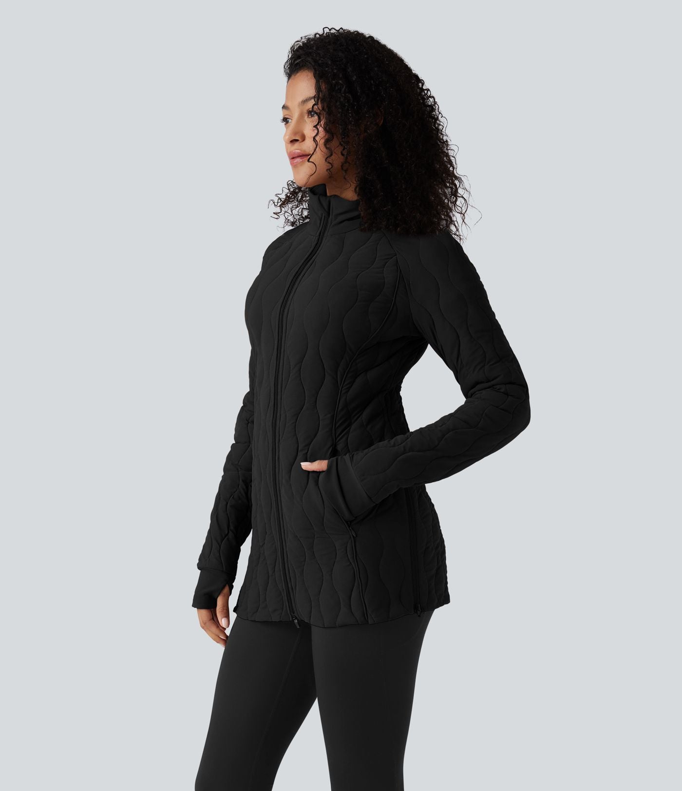 Veste matelassée de sport PuffFlex à col montant, manches longues, fermeture éclair avec passe-pouces et poches