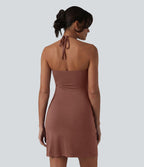 Robe resort mini dos nu à col licou avec lien noué dans le dos et poches