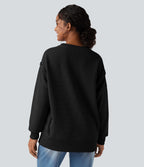 Sweat-shirt gaufré col rond ourlet fendu manches longues