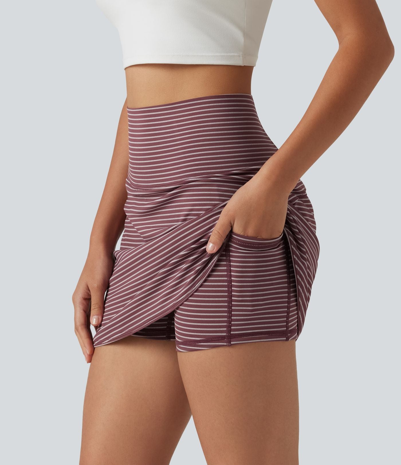 Mini-jupe de golf 2 en 1 à rayures, taille ultra haute, effet ventre plat, ourlet arrondi et poches
