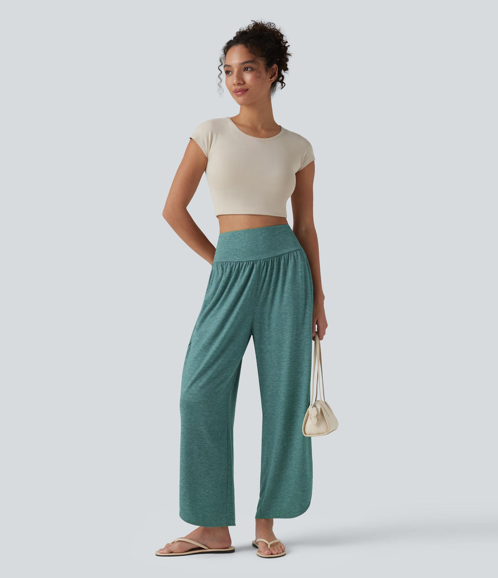 Pantalon décontracté taille haute gainant avec ourlet arrondi et poches