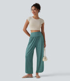Pantalon décontracté taille haute gainant avec ourlet arrondi et poches