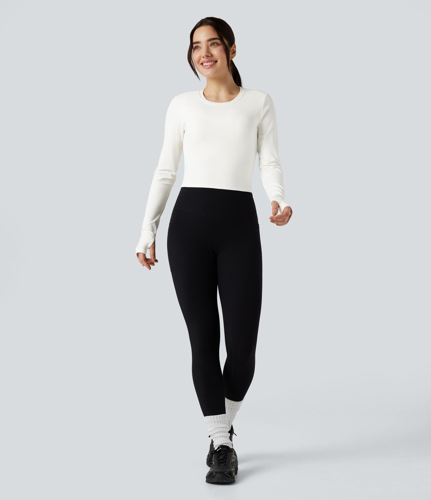 Top de sport yoga col rond dos nu torsadé manches longues avec trous pouces