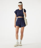 Short de yoga baggy 2-en-1 Breezeful™ taille haute à ourlet arrondi, séchage rapide, lignes réfléchissantes et poches