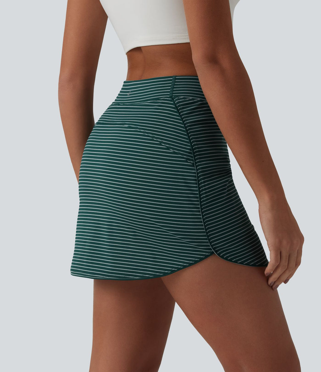 Jupe de golf mini moulante 2-en-1 taille haute à rayures avec poches