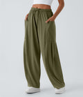 Pantalon Large Fluide Taille Mi-Haute Taille Élastique Cordon Poches Latérales Ourlet Flottant