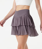 Jupe-short tennis mini fluide taille haute croisée en mesh à volants, avec poches