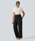 Pantalon effet lin taille haute avec cordon de serrage, bord volanté et poches