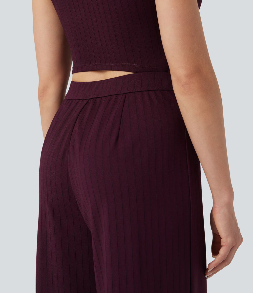 Combinaison tailleur rayée à jambes larges, décolleté en V, découpe et poches