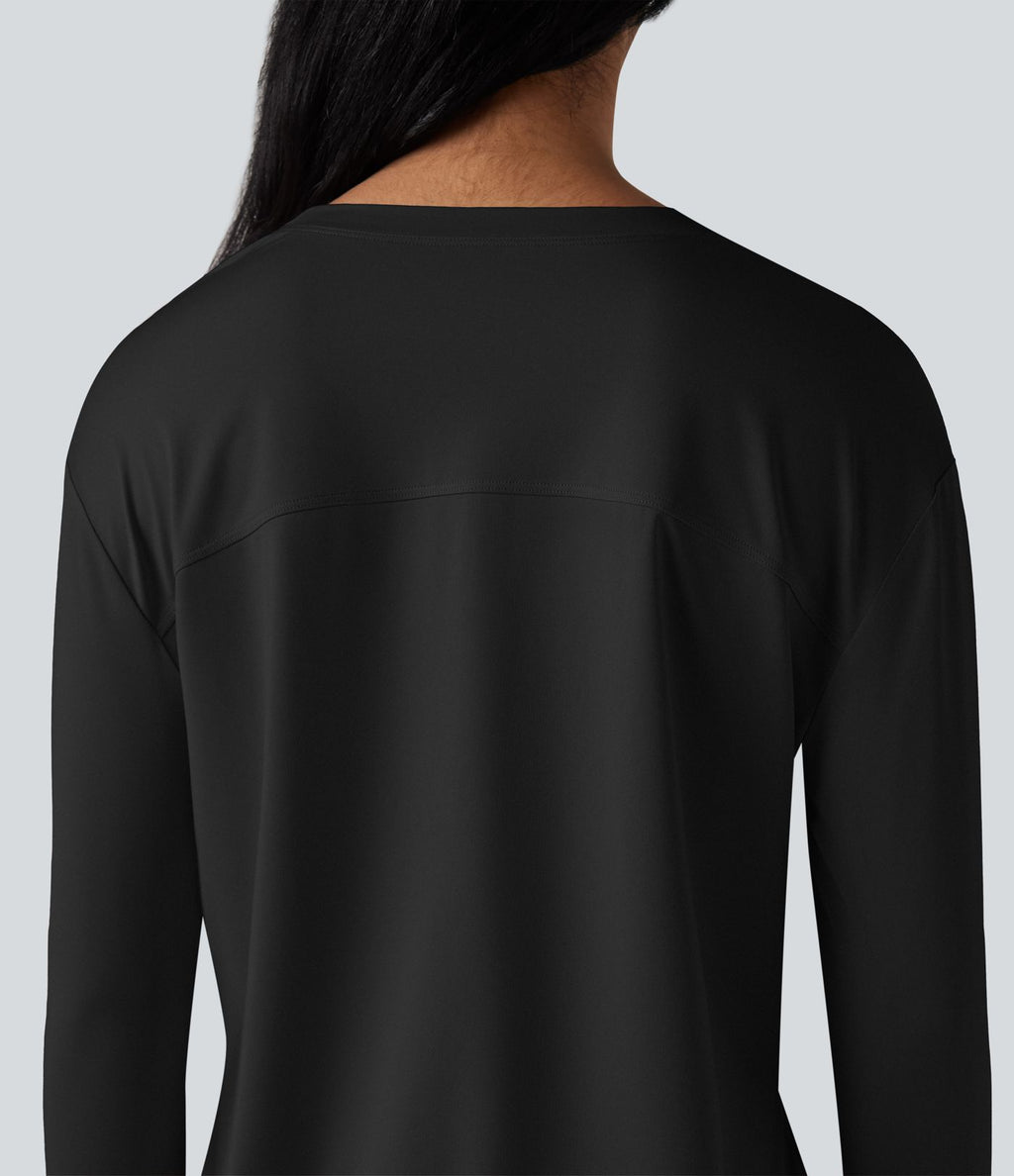 Top de sport running col rond fendu manches longues avec trous pouces