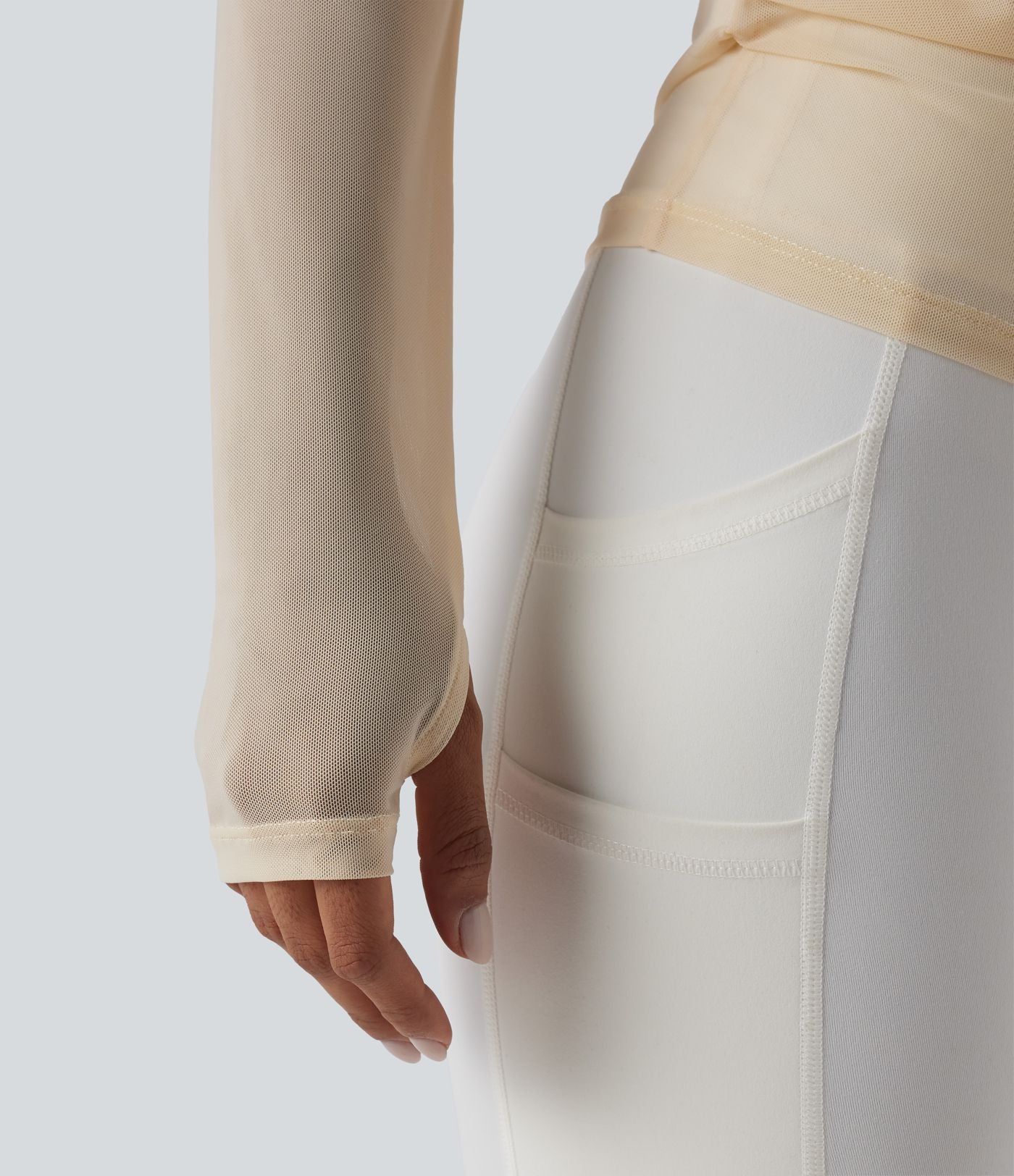 Haut de yoga asymétrique manches longues mesh avec ouverture pouce