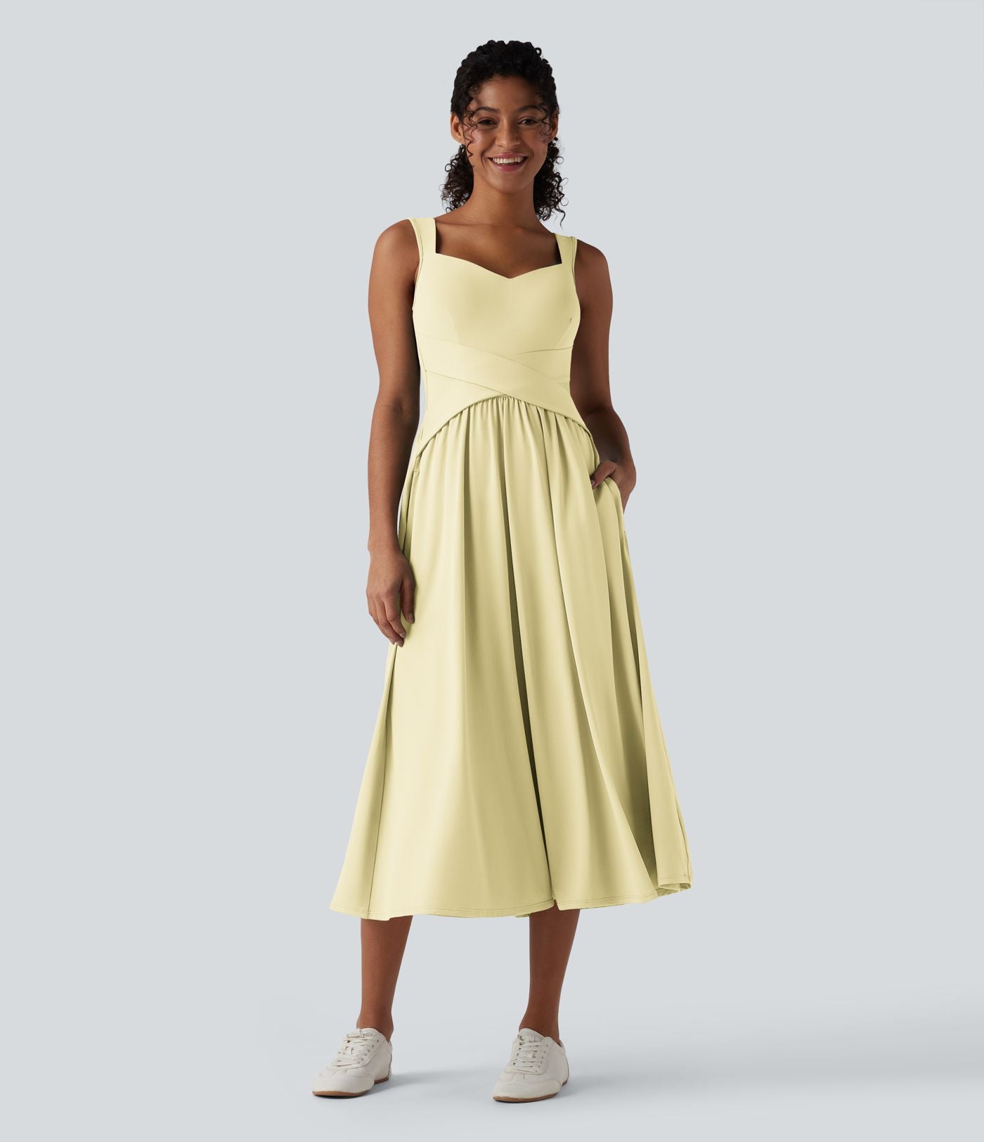 Robe midi fluide sans manches dos croisé ouvert avec poches