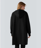 Sweat-shirt long en coton à capuche zippé à manches longues avec ourlet arrondi et poches
