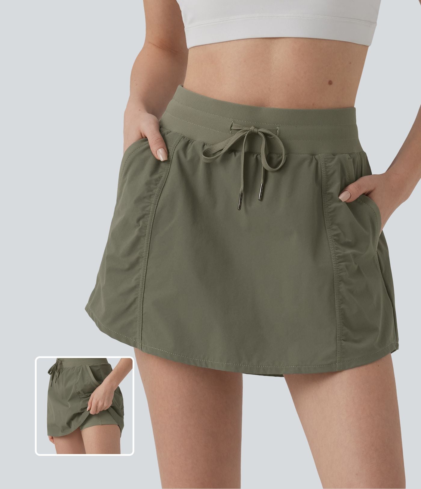 Jupe de sport mini 2-en-1 taille haute coupe trapèze avec cordon de serrage et poches