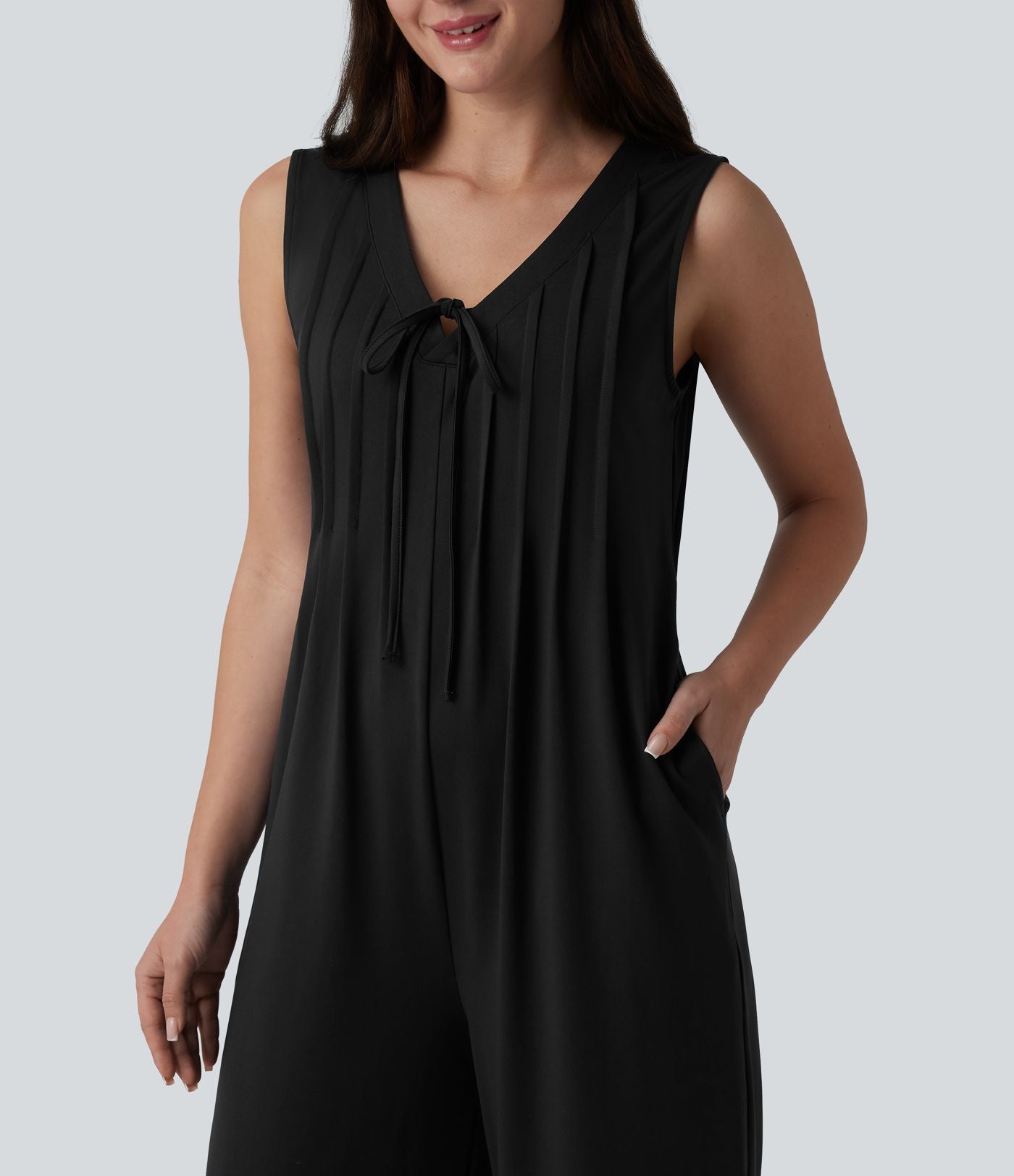 Combinaison casual ample décolleté plongeant sans manches plissée à nœud devant et fermeture éclair invisible avec poches