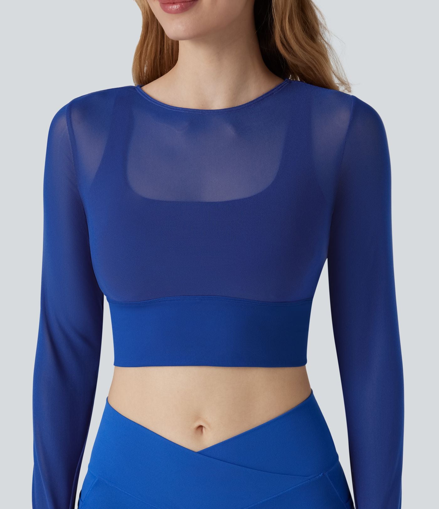 Haut de sport yoga cropped 2-en-1 manches longues mesh contrastant à trous pouces