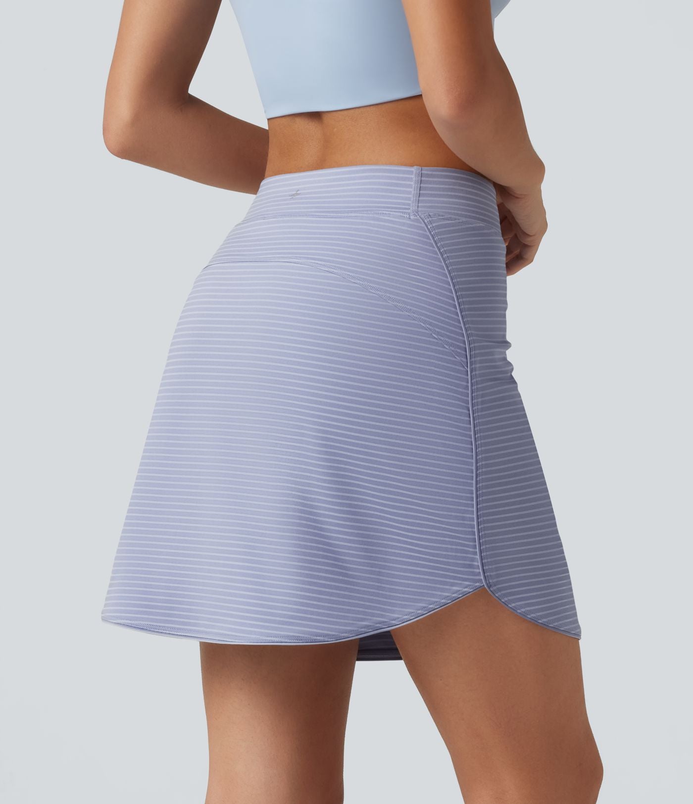 Jupe de golf mini moulante 2-en-1 taille haute à rayures à poches — longueur prolongée