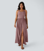 Robe longue fluide fendue avec poches latérales, dos nu et effet torsadé