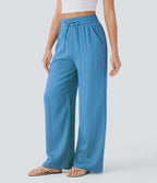 Pantalon large fluide taille haute avec cordon de serrage, poches latérales et aspect lin