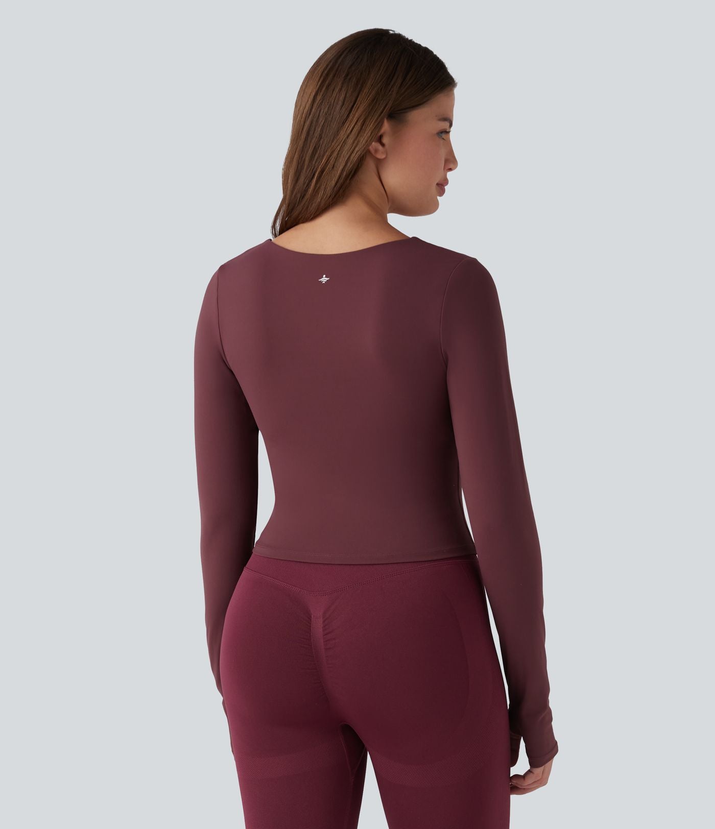 Haut de yoga SoftlyZero™ Plush push-up à col arrondi, manches longues, trous pour les pouces et poches