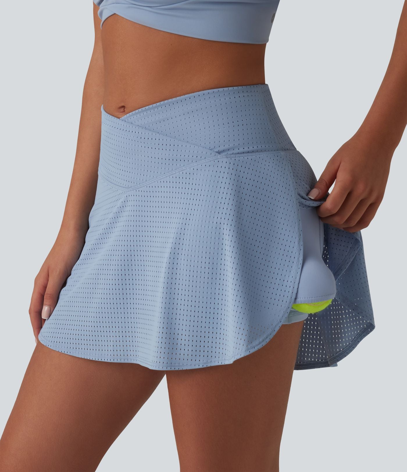 Jupe mini de tennis à œillets, taille haute, 2 en 1, coupe trapèze, croisée, avec poches