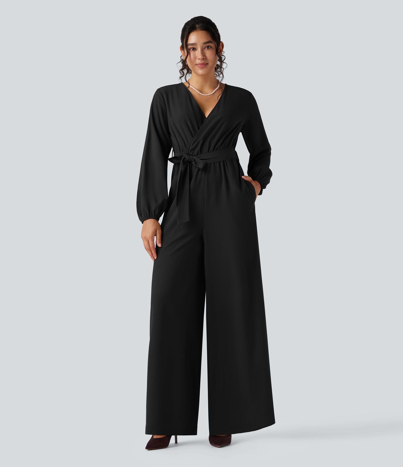 Combinaison pantalon de soirée large à décolleté en V, manches longues bouffantes, ceinture et poches
