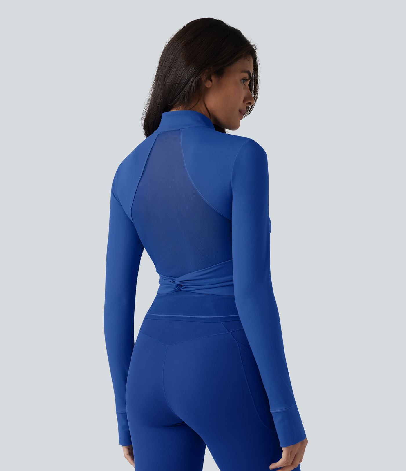 SoftlyZero™ Plush Veste de yoga col montant à manches longues avec trous pour les pouces, dos torsadé, empiècements en mesh respirant et poches