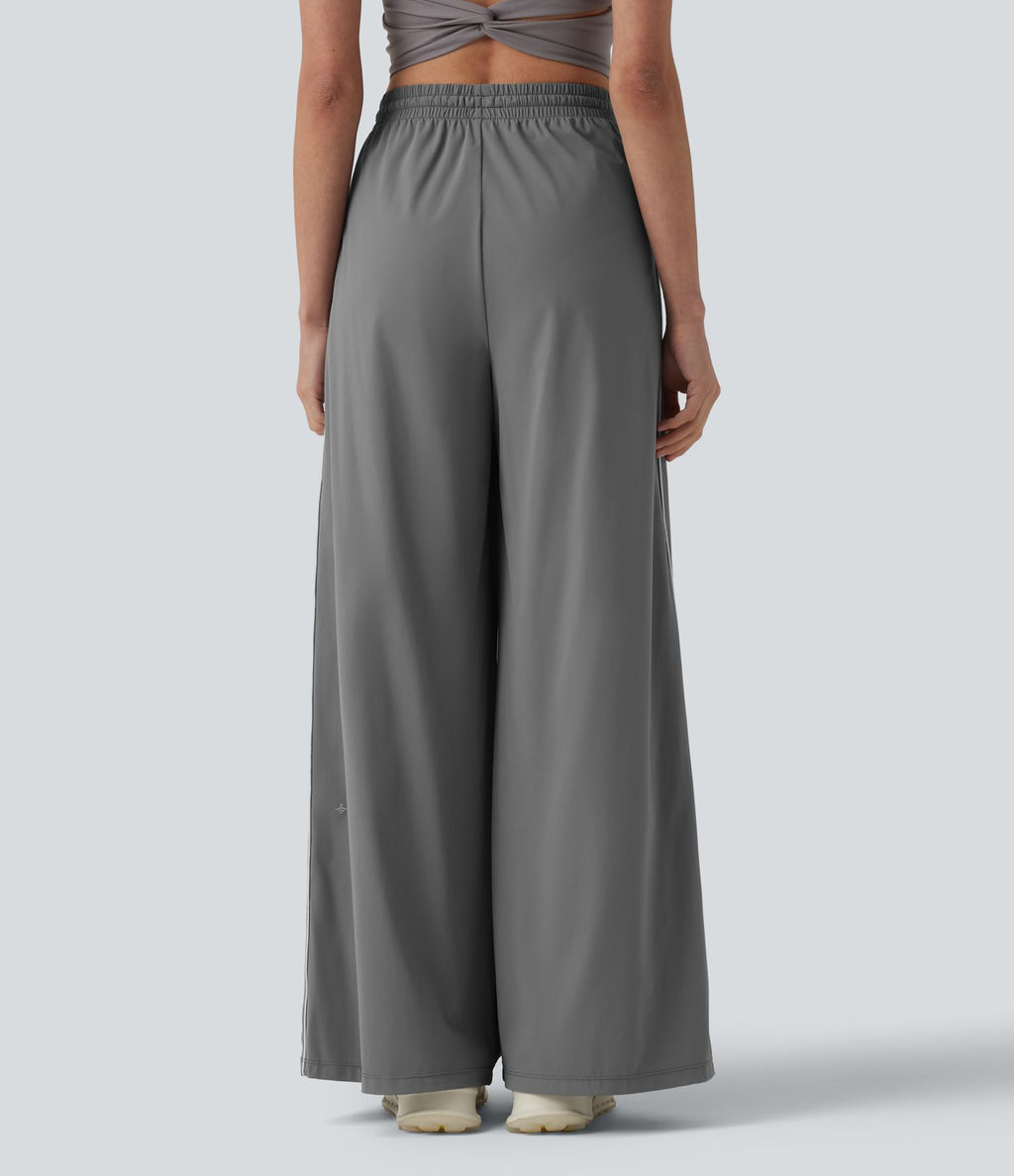 Pantalon running large à rayures taille haute avec cordon de serrage, séchage rapide et effet frais InstantCool avec poches, protection solaire UPF40+