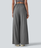 Pantalon running large à rayures taille haute avec cordon de serrage, séchage rapide et effet frais InstantCool avec poches, protection solaire UPF40+