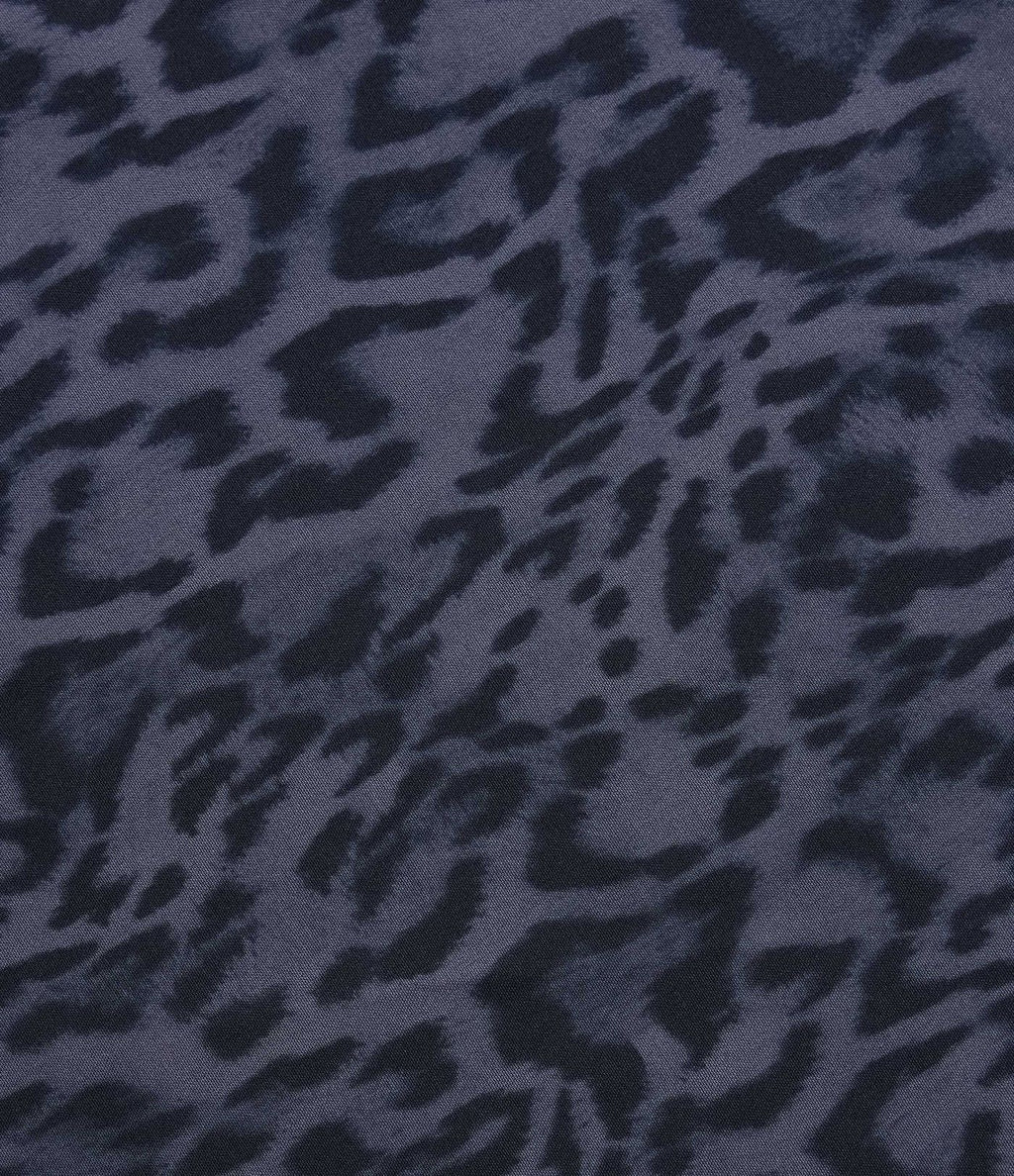Jupe tennis mini fluide 2-en-1 taille haute imprimé léopard avec liens latéraux et poche