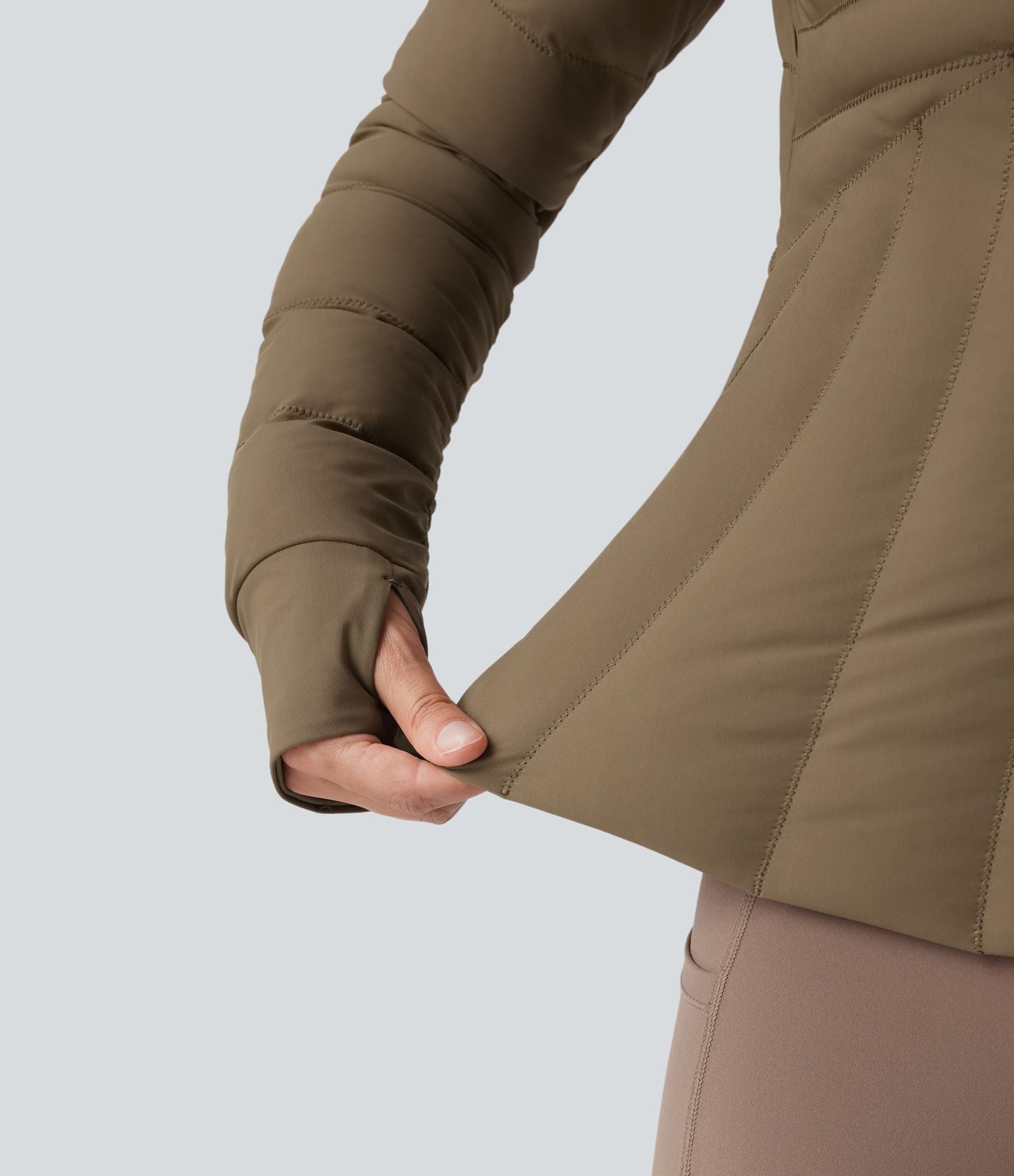 Doudoune de sport extensible col montant avec passants pouces et poches