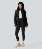 Veste matelassée de sport PuffFlex à col montant, manches longues, fermeture éclair avec passe-pouces et poches