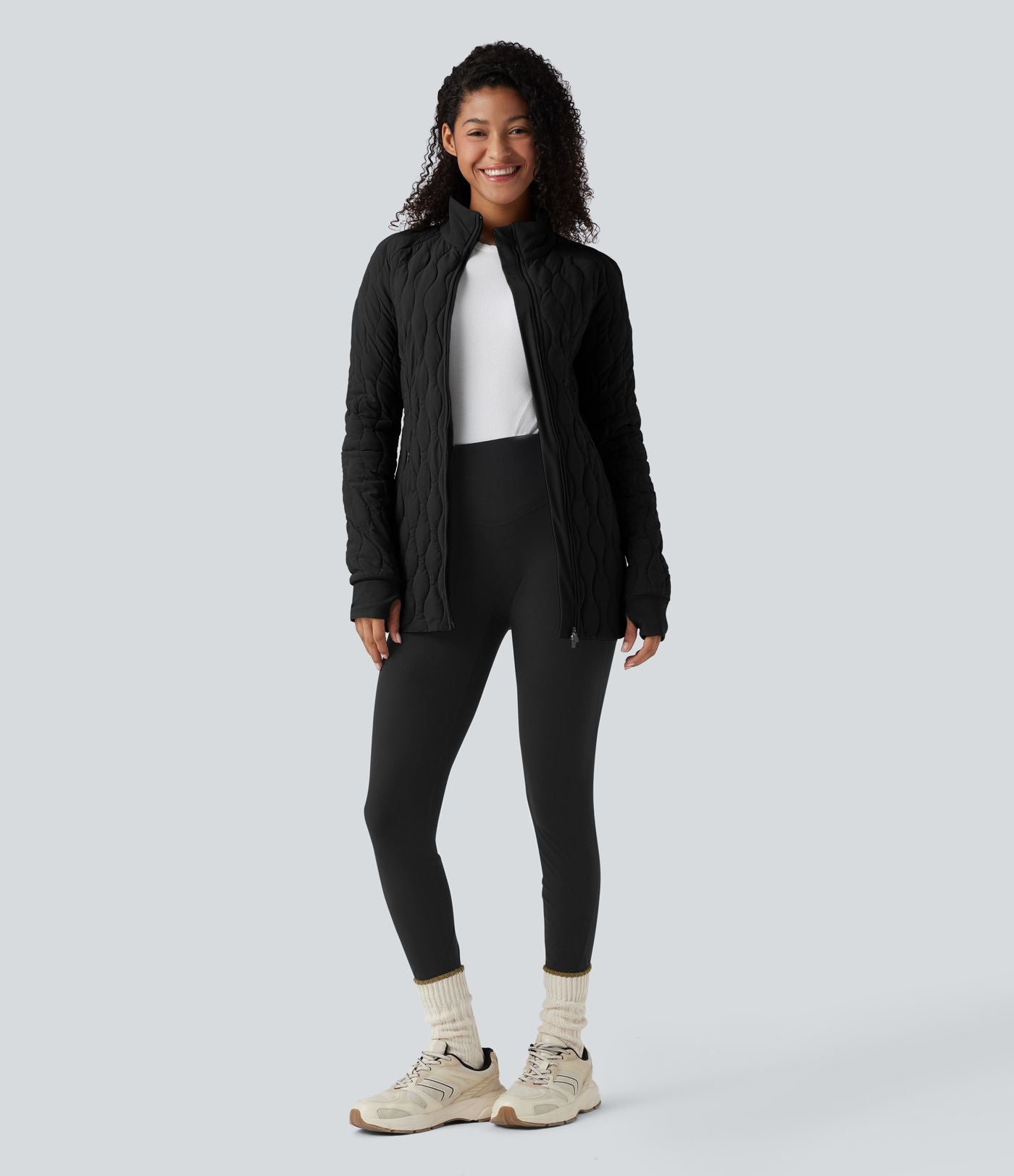 Veste matelassée de sport PuffFlex à col montant, manches longues, fermeture éclair avec passe-pouces et poches