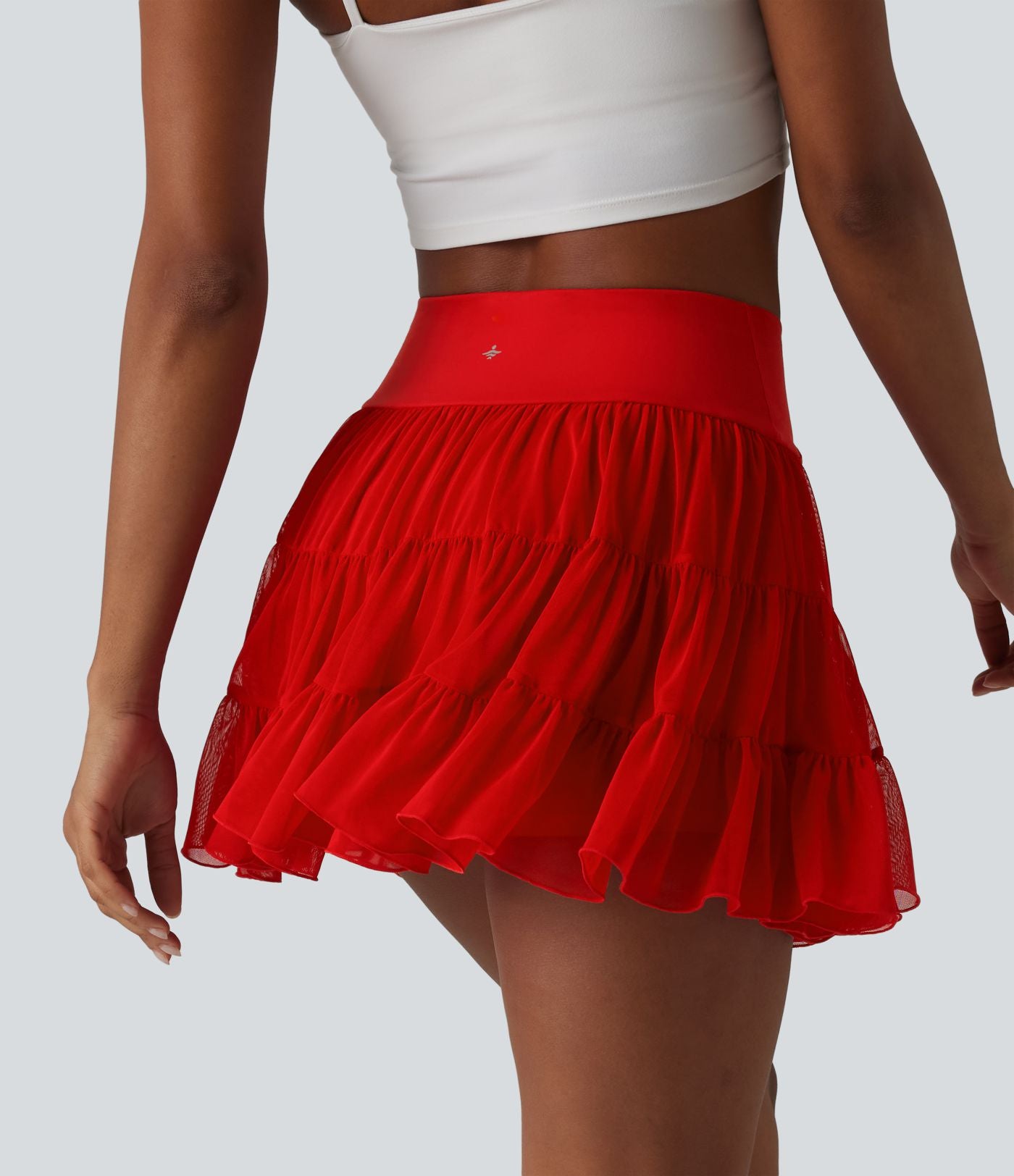 Jupe-short de tennis mini taille haute croisée fluide avec poches