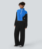 Sweat bicolore en polaire col montant avec demi-zip et manches longues