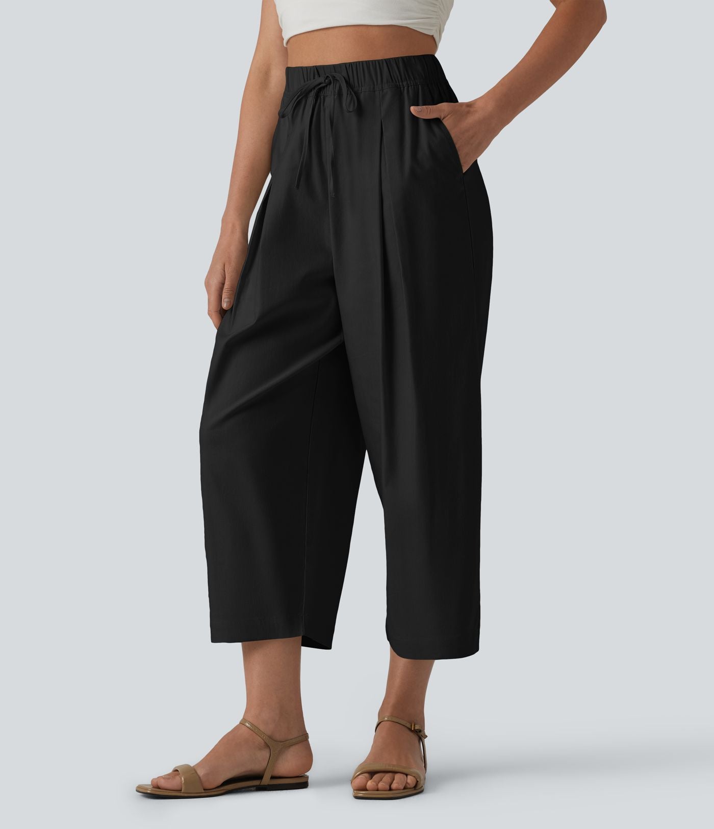 Pantalon casual court en coton et lin taille haute coupe ballon avec cordon de serrage et poches