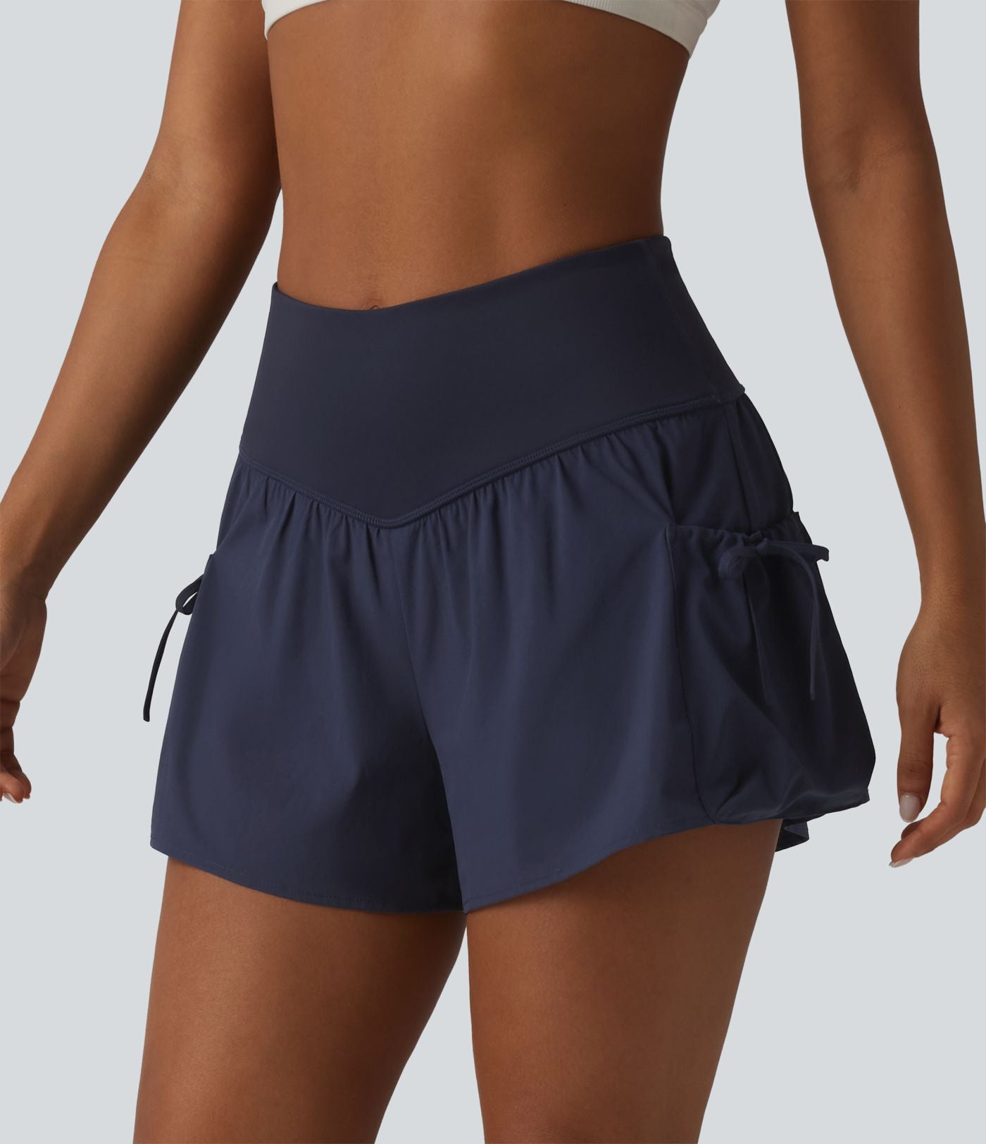 Short de sport ample 2 en 1 taille haute avec poches