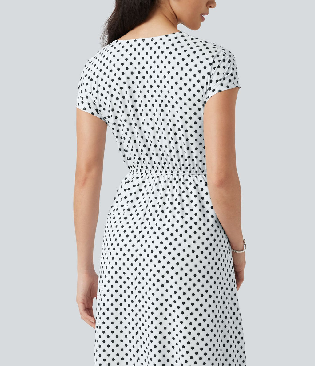 Robe midi à pois col V avec manches courtes, lien côté et poches