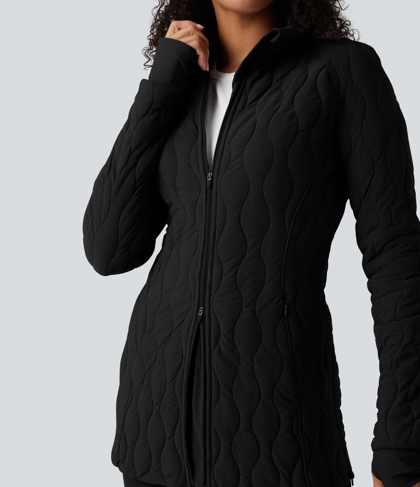 Veste matelassée de sport PuffFlex à col montant, manches longues, fermeture éclair avec passe-pouces et poches