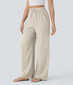 Pantalon large fluide taille haute avec cordon de serrage, poches latérales et aspect lin