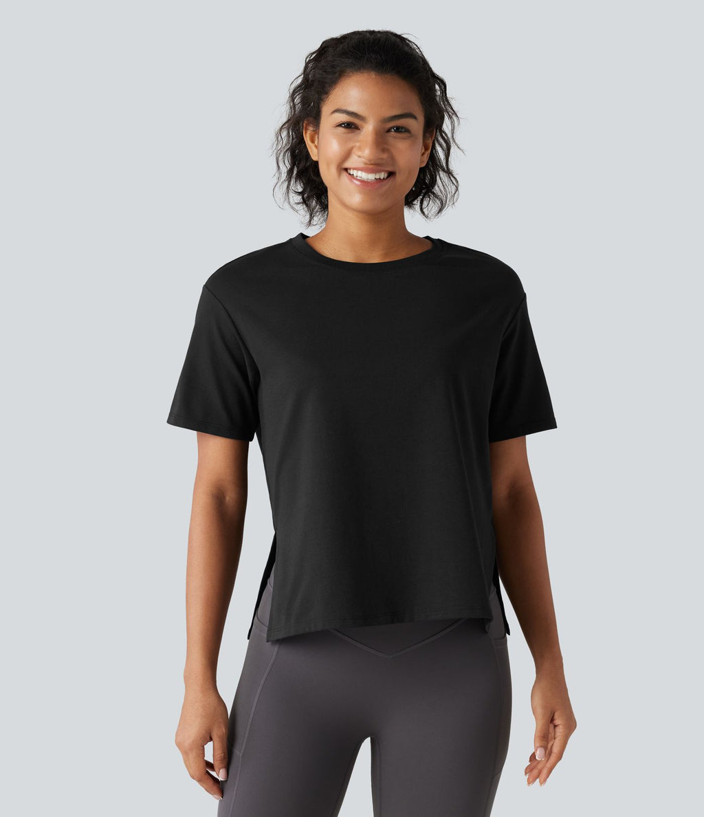 Haut de sport en coton col rond à manches courtes, ourlet fendu et coupe ample pour le yoga