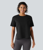 Haut de sport en coton col rond à manches courtes, ourlet fendu et coupe ample pour le yoga