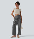 Pantalon décontracté taille haute gainant avec ourlet arrondi et poches