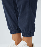 Pantalon décontracté en velours côtelé avec taille mi-haute, boutons et fermeture éclair