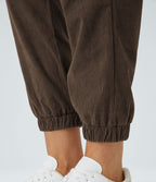 Pantalon décontracté en velours côtelé avec taille mi-haute, boutons et fermeture éclair